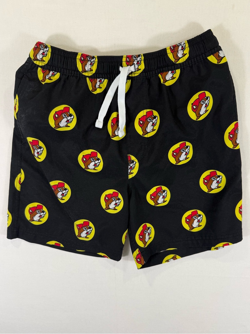 Kids Black Graphic Swim Shorts with Yellow & Red Badge Print
